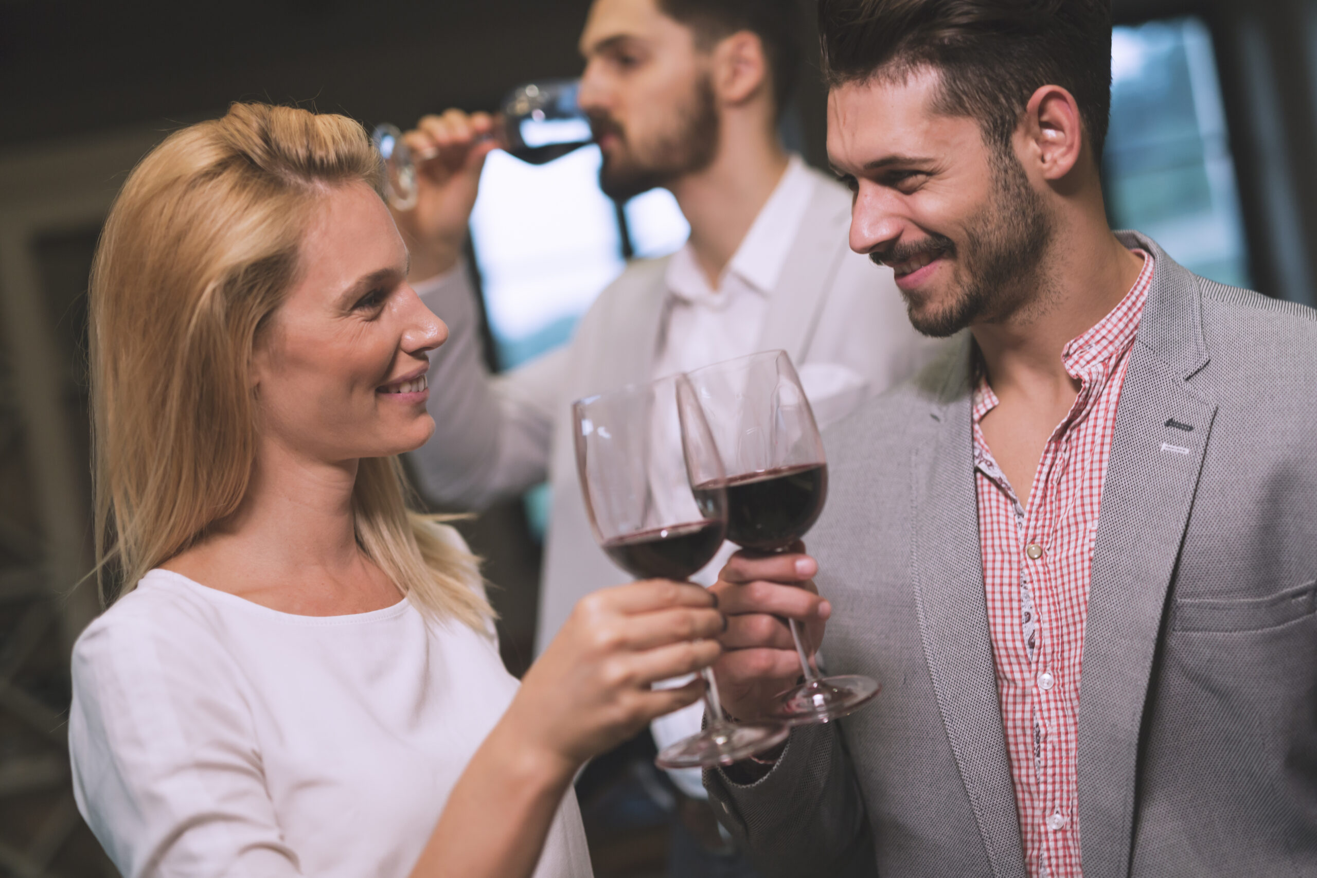 The purpose of the image is to show a couple having drinks together trying to vet other couples into the lifestyle.
